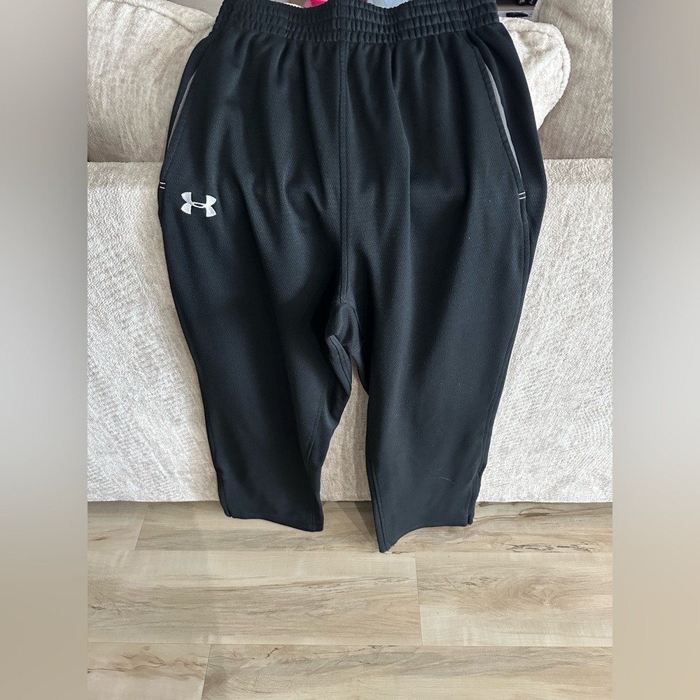 Medium gray under Armour, sweatpants with zippers on the bottom